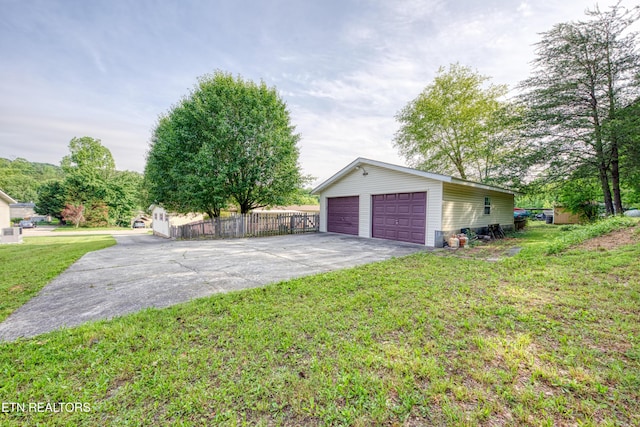 310 Abbott Rd, Lenoir City, TN 37771 - view of home's exterior featuring an outbuilding and a garage