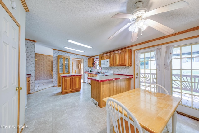 310 Abbott Rd, Lenoir City, TN 37771 - kitchen featuring white appliances, wallpapered walls, ornamental molding, a textured ceiling, and a peninsula