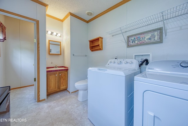 310 Abbott Rd, Lenoir City, TN 37771 - laundry area with crown molding, washing machine and dryer, and baseboards