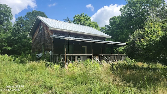 1935 Fairview Rd, Tellico Plains, TN 37385 - view of home's exterior featuring metal roof and covered porch