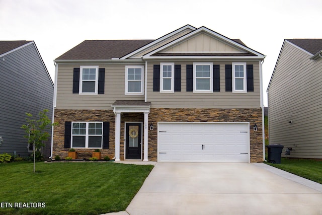 craftsman-style home featuring stone siding, driveway, board and batten siding, a garage, and a front yard