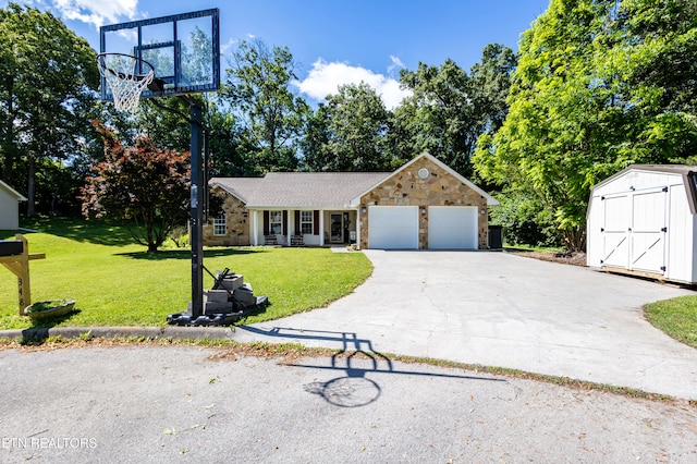 348 Willie D Dr, Jefferson City, TN 37760 - view of front of home with stone siding, a front lawn, a garage, and concrete driveway