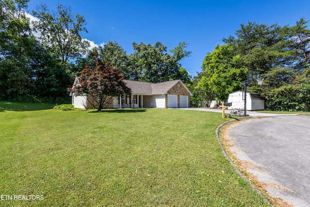 348 Willie D Dr, Jefferson City, TN 37760 - view of front of home featuring a front lawn, asphalt driveway, and a garage