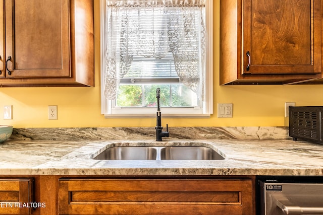 348 Willie D Dr, Jefferson City, TN 37760 - kitchen featuring a sink, brown cabinetry, stainless steel dishwasher, and light stone countertops