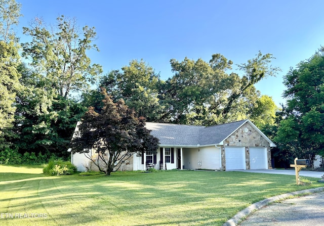 348 Willie D Dr, Jefferson City, TN 37760 - view of front of property with a garage, a front lawn, concrete driveway, and stone siding