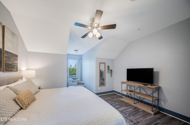 bedroom with wood finished floors, ceiling fan, vaulted ceiling, and baseboards