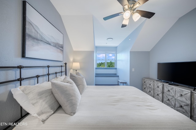bedroom featuring vaulted ceiling and a ceiling fan