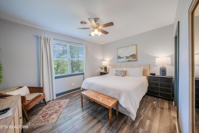 bedroom with wood finished floors, ceiling fan, and baseboards