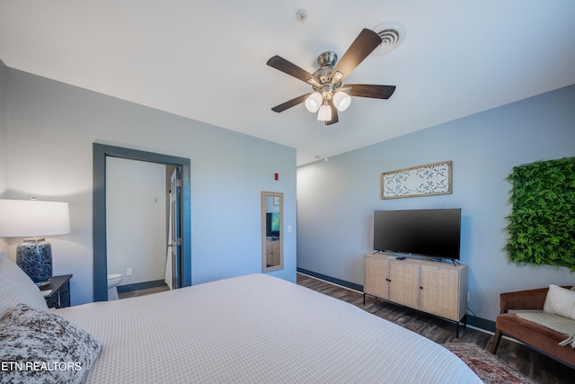 bedroom with wood finished floors, baseboards, and a ceiling fan