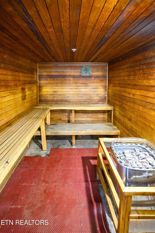 sauna with wooden walls and wood ceiling