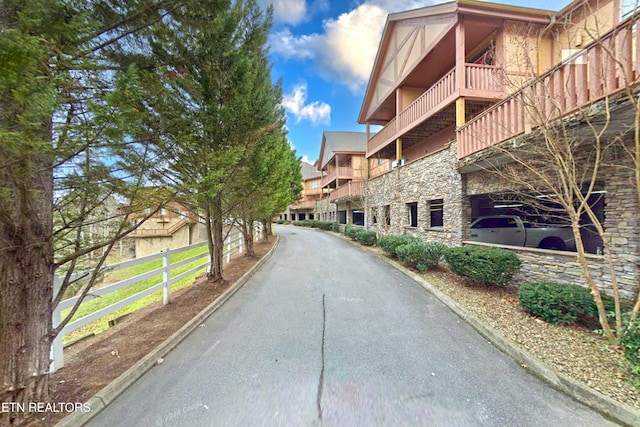 view of road featuring curbs