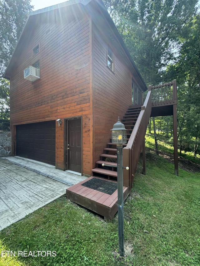 1186 Deerfield Way, Lafollette, TN 37766 - view of home's exterior with stairway, a garage, driveway, a wooden deck, and cooling unit