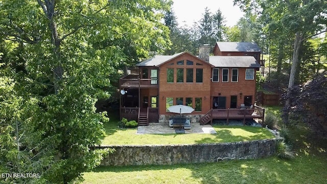 1186 Deerfield Way, Lafollette, TN 37766 - rear view of house featuring a patio, a lawn, a deck, and an outdoor hangout area