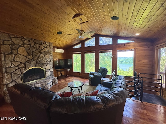 1186 Deerfield Way, Lafollette, TN 37766 - living room with an AC wall unit, hardwood / wood-style flooring, vaulted ceiling, wooden ceiling, and a stone fireplace