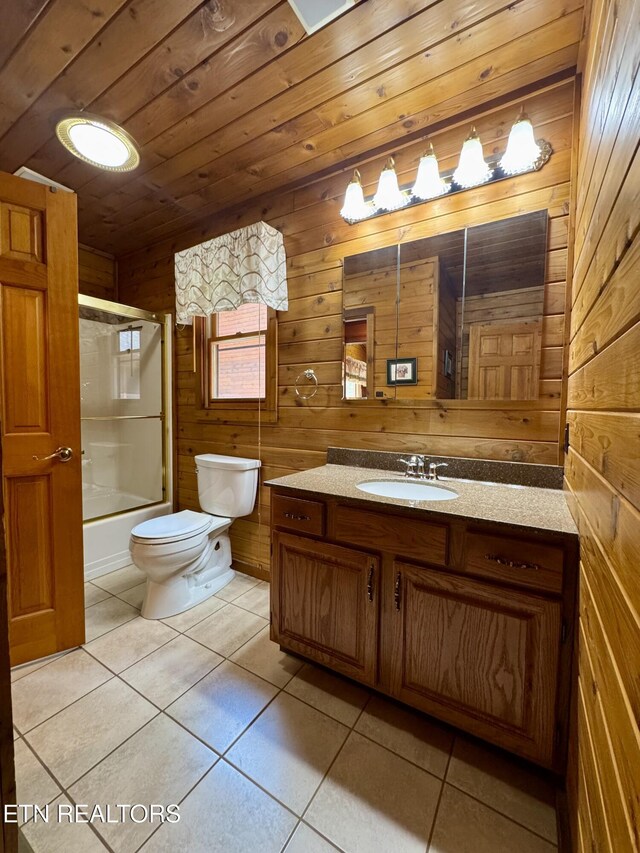 1186 Deerfield Way, Lafollette, TN 37766 - full bathroom with tile patterned flooring, vanity, toilet, bath / shower combo with glass door, and wooden walls