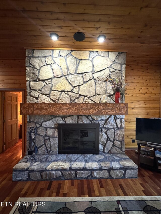 1186 Deerfield Way, Lafollette, TN 37766 - detailed view of a stone fireplace, wood finished floors, and wood walls