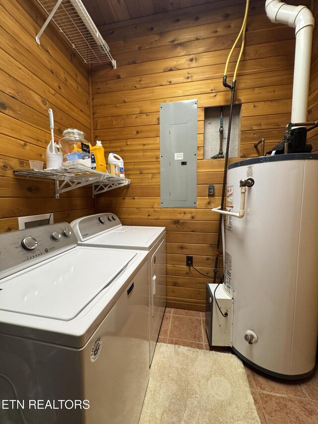 1186 Deerfield Way, Lafollette, TN 37766 - laundry area featuring electric panel, washer and clothes dryer, water heater, light tile patterned floors, and wooden walls