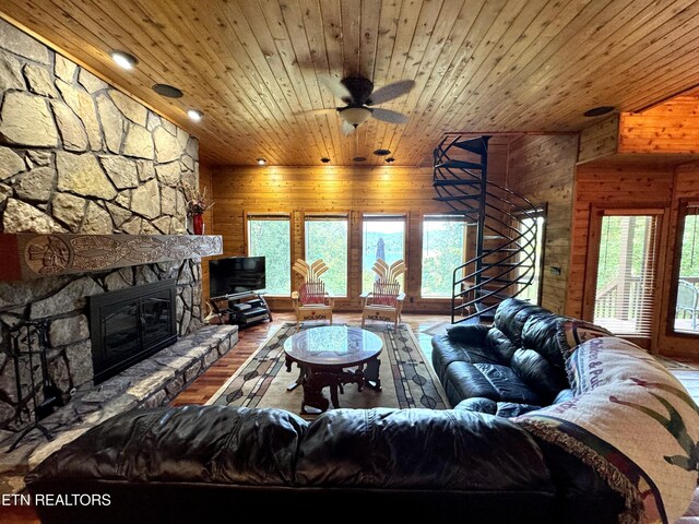 1186 Deerfield Way, Lafollette, TN 37766 - living area with wood walls, wooden ceiling, healthy amount of natural light, a fireplace, and wood finished floors