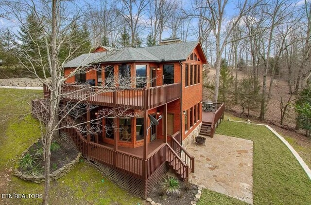 1186 Deerfield Way, Lafollette, TN 37766 - rear view of property with a wooden deck, stairs, a patio area, a shingled roof, and a lawn