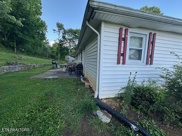 179 Granby Ln, Harrogate, TN 37752 - view of property exterior with a patio and a lawn