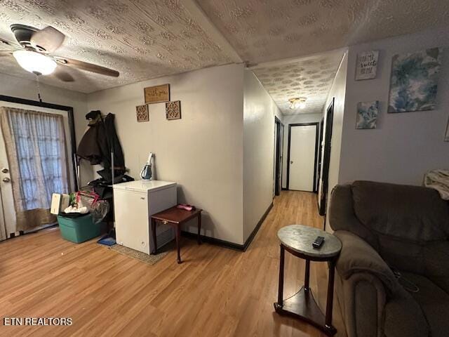 179 Granby Ln, Harrogate, TN 37752 - living room featuring ceiling fan, light wood finished floors, a textured ceiling, and baseboards