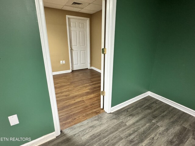 211 Jamie St, Maynardville, TN 37807 - empty room featuring a drop ceiling, baseboards, and dark wood-style flooring