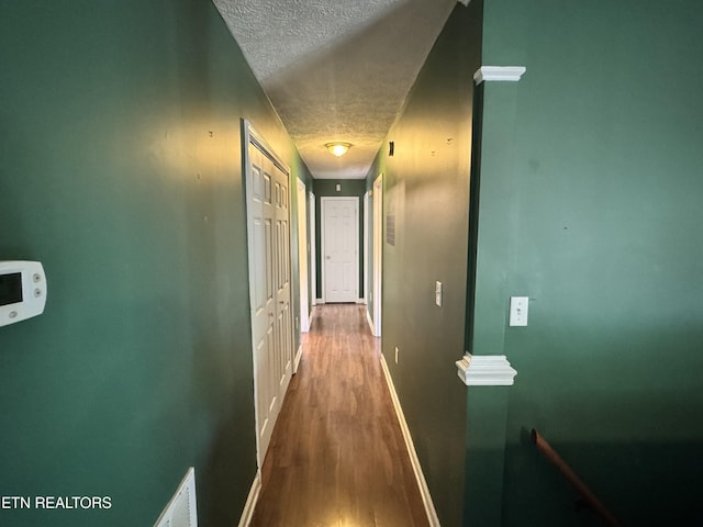 211 Jamie St, Maynardville, TN 37807 - corridor with a textured ceiling, wood finished floors, and baseboards