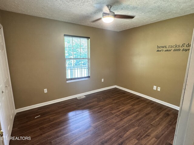 211 Jamie St, Maynardville, TN 37807 - spare room featuring dark wood finished floors, ceiling fan, baseboards, and a textured ceiling