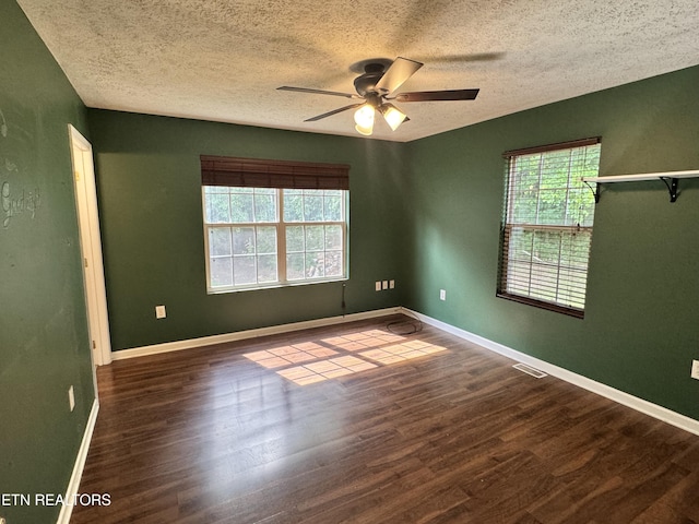 211 Jamie St, Maynardville, TN 37807 - unfurnished room with healthy amount of natural light, ceiling fan, wood finished floors, and a textured ceiling