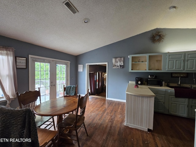 291 Tall Oaks Dr, Pennington Gap, VA 24277 - dining space with lofted ceiling, french doors, dark wood-style floors, a textured ceiling, and baseboards