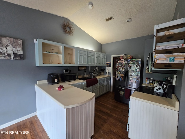 291 Tall Oaks Dr, Pennington Gap, VA 24277 - kitchen with black appliances, open shelves, light countertops, a peninsula, and dark wood-style flooring