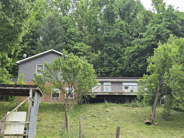 291 Tall Oaks Dr, Pennington Gap, VA 24277 - back of property featuring a deck, a yard, and brick siding