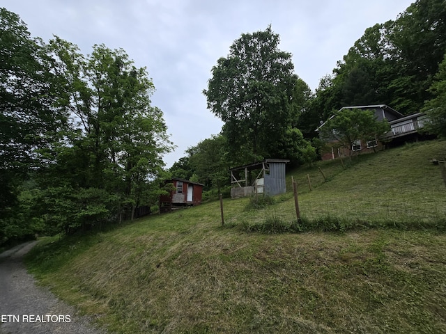 291 Tall Oaks Dr, Pennington Gap, VA 24277 - view of green lawn featuring an outbuilding