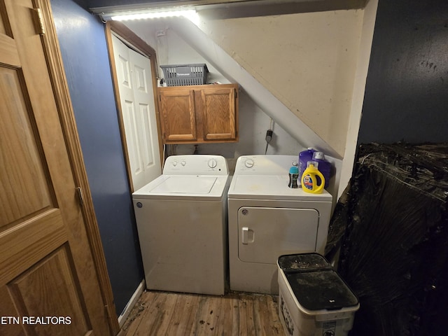 291 Tall Oaks Dr, Pennington Gap, VA 24277 - laundry room featuring separate washer and dryer, light wood finished floors, and cabinet space