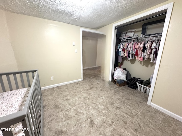 108 E Hunter Cir, Oak Ridge, TN 37830 - unfurnished bedroom with a closet, a textured ceiling, and baseboards