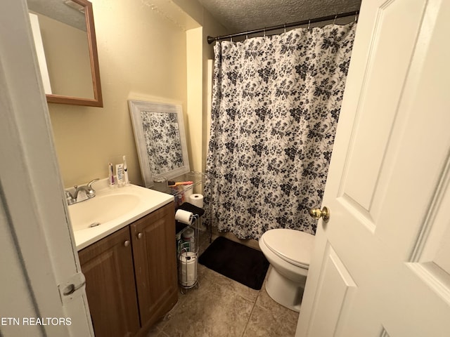 108 E Hunter Cir, Oak Ridge, TN 37830 - bathroom with toilet, a textured ceiling, vanity, tile patterned flooring, and curtained shower