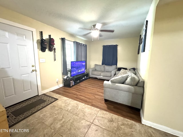 108 E Hunter Cir, Oak Ridge, TN 37830 - living room with tile patterned floors, baseboards, and a ceiling fan