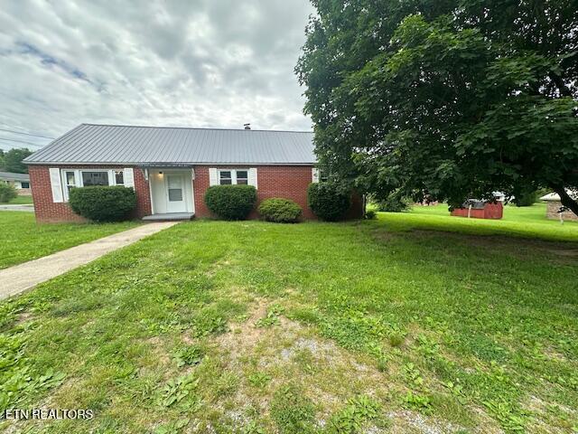 156 Beatty Rd, Rose Hill, VA 24281 - view of front facade with a front lawn, metal roof, and brick siding