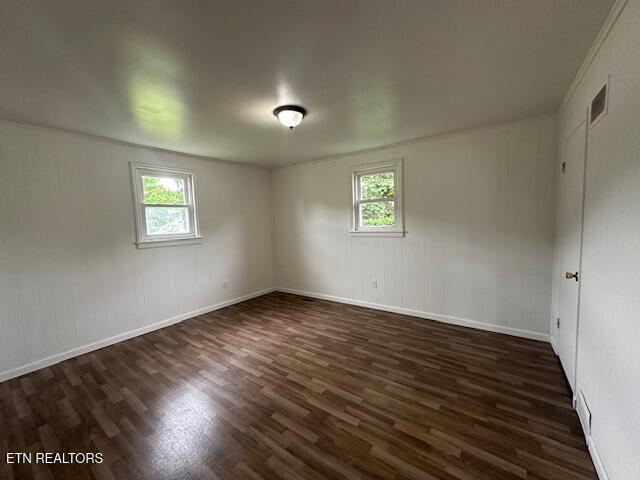 156 Beatty Rd, Rose Hill, VA 24281 - spare room with dark wood-style flooring, healthy amount of natural light, and baseboards