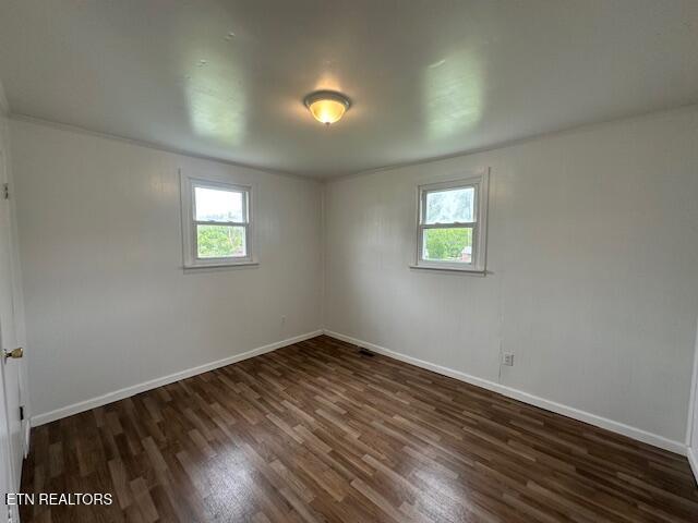 156 Beatty Rd, Rose Hill, VA 24281 - unfurnished room with healthy amount of natural light, dark wood-style flooring, and baseboards