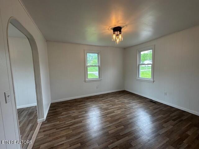 156 Beatty Rd, Rose Hill, VA 24281 - spare room with plenty of natural light, wood finished floors, and arched walkways