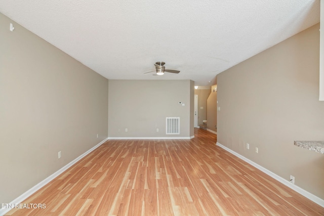 1051 Nod St, Knoxville, TN 37932 - unfurnished room featuring ceiling fan, baseboards, light wood-type flooring, and a textured ceiling