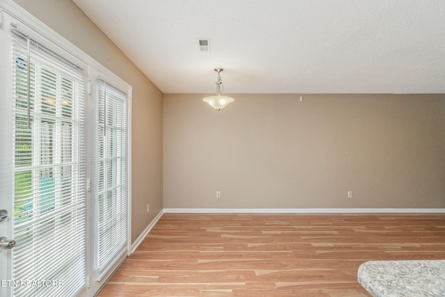 1051 Nod St, Knoxville, TN 37932 - unfurnished dining area with light wood-type flooring and baseboards