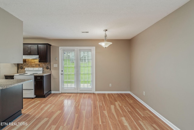 1051 Nod St, Knoxville, TN 37932 - kitchen with electric stove, light countertops, light wood finished floors, and baseboards