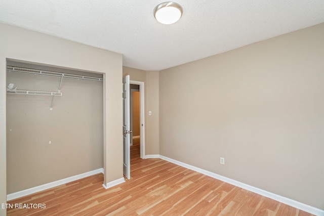 1051 Nod St, Knoxville, TN 37932 - unfurnished bedroom with a closet, light wood finished floors, and baseboards