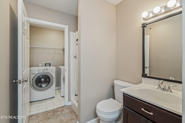 1051 Nod St, Knoxville, TN 37932 - bathroom featuring washer / dryer, toilet, vanity, and a shower