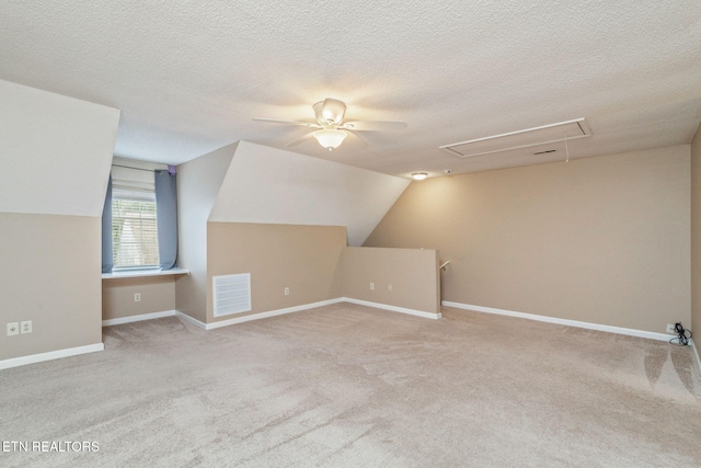 1051 Nod St, Knoxville, TN 37932 - additional living space featuring attic access, carpet floors, a ceiling fan, a textured ceiling, and baseboards