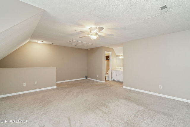 1051 Nod St, Knoxville, TN 37932 - bonus room with light carpet, lofted ceiling, baseboards, a ceiling fan, and a textured ceiling
