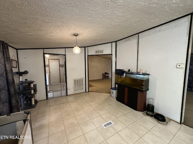 214 Hickory Grove Rd, Madisonville, TN 37354 - unfurnished living room featuring a textured ceiling and tile patterned flooring