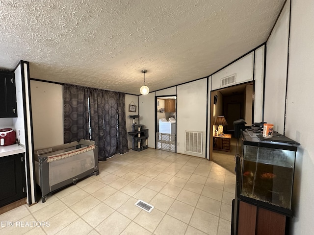 214 Hickory Grove Rd, Madisonville, TN 37354 - living room featuring a textured ceiling and light tile patterned floors